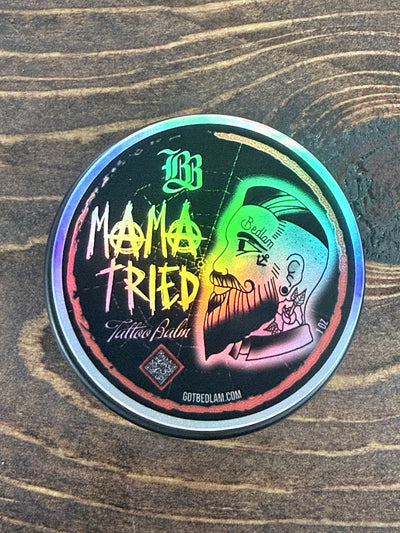 Holographic sticker with colorful design on a wooden surface